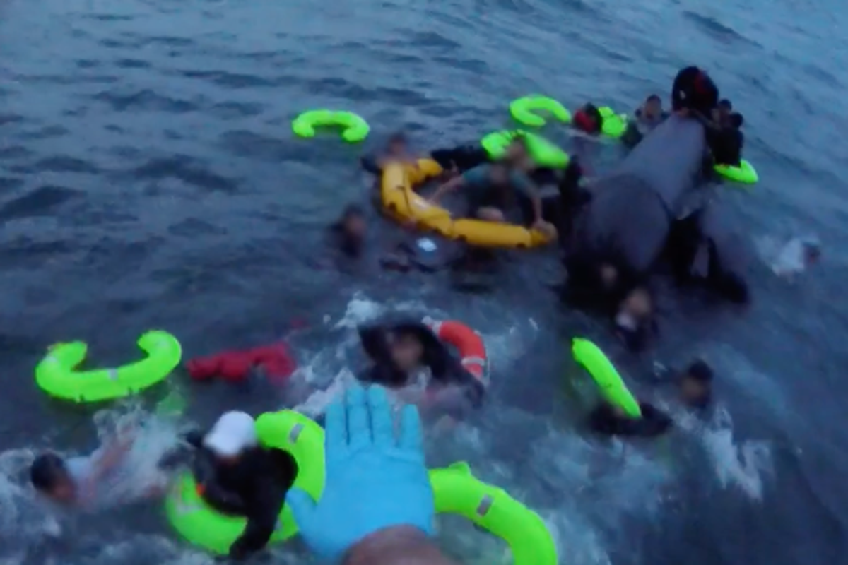 Dramatic footage shows RNLI lifeboat crew rescue 19 migrants from stricken dinghy in English Channel