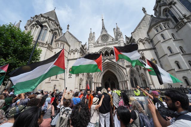 <p>Protesters outside the Royal Courts of Justice on The Strand, central London, ahead of a hearing over whether proscribing of Palestine Action should be temporarily blocked</p>