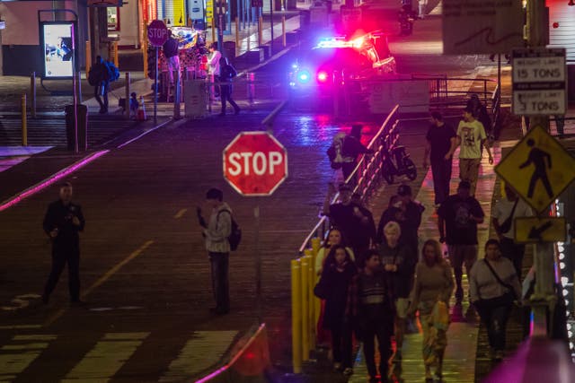 <p>A police officer drives at Santa Monica Pier while warning the public about the regular closure time of the pier amid a tsunami warning in Santa Monica, California, on 29 July</p>
