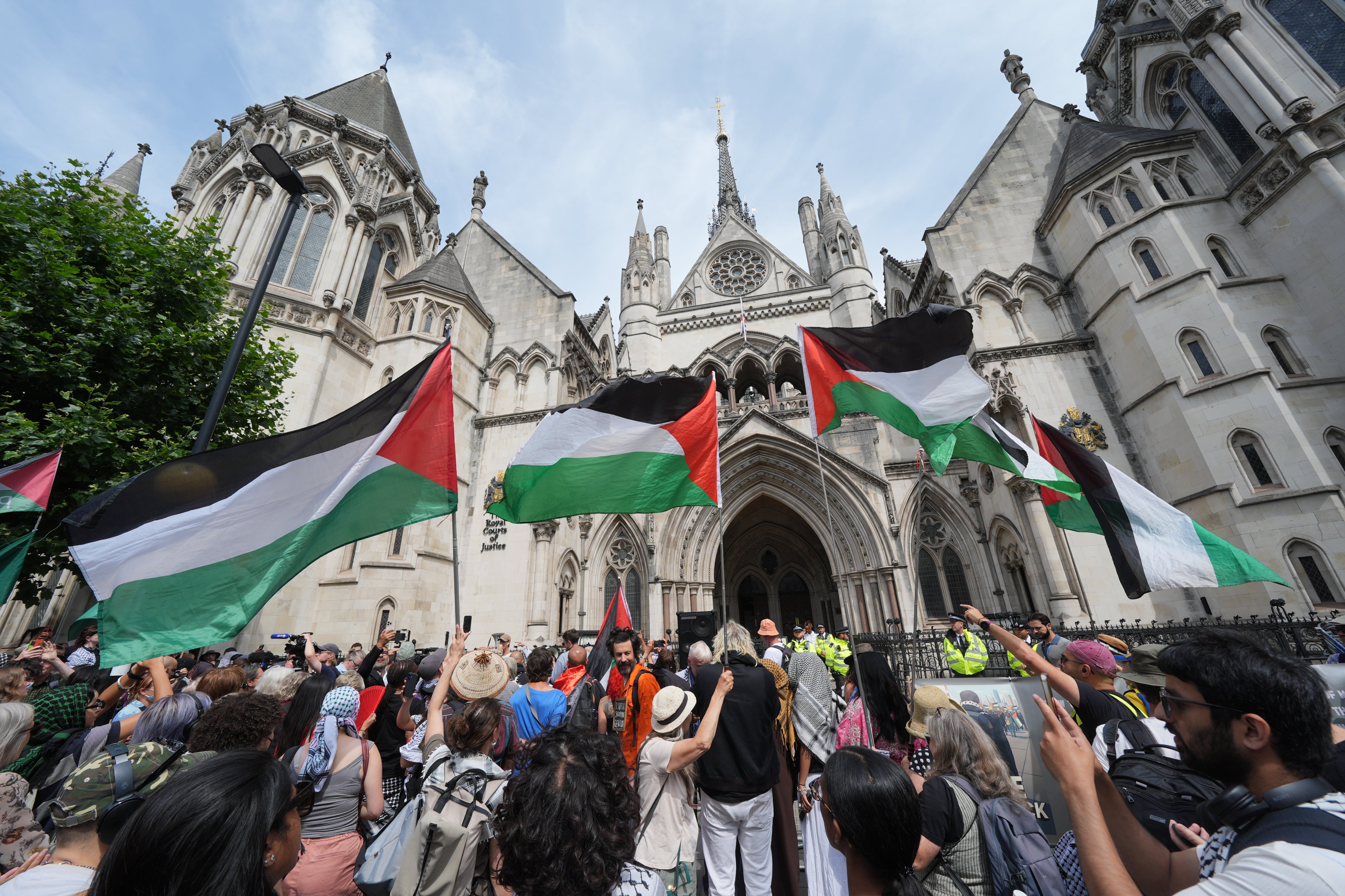 Protesters outside the Royal Courts of Justice on The Strand, central London, ahead of a hearing over whether proscribing of Palestine Action should be temporarily blocked.