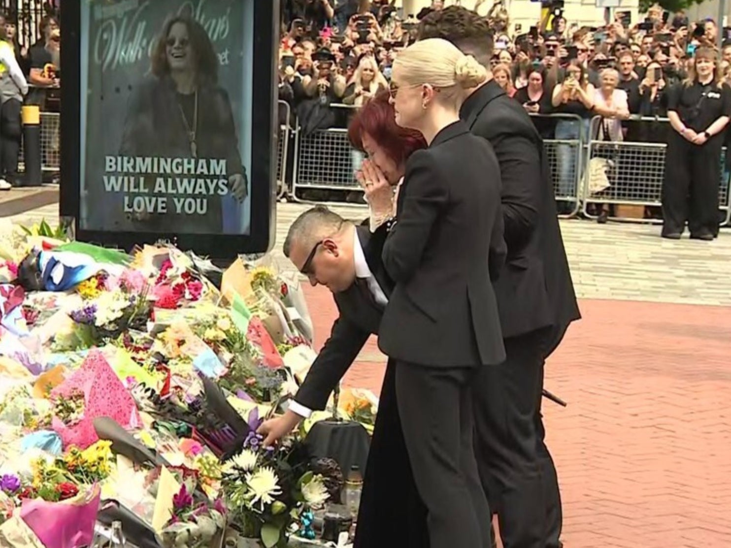 Jack, Sharon and Kelly Osbourne lay flowers at an Ozzy memorial in Birmingham