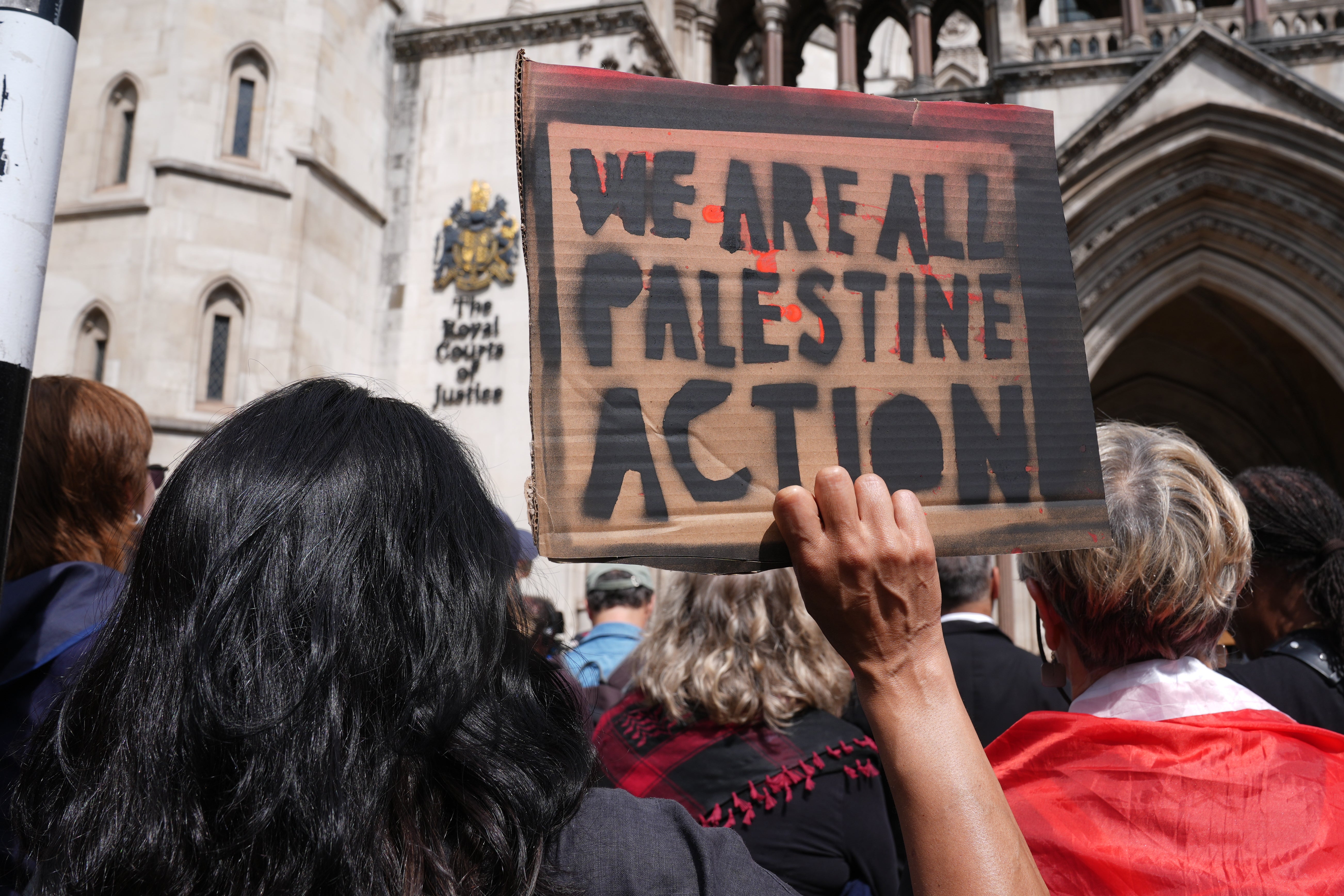 Protesters outside the Royal Courts of Justice on The Strand, central London