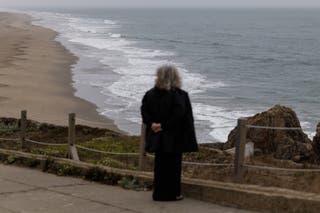 A person observes the sea at Ocean Beach, California