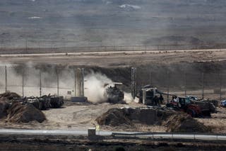 An Israeli APC crosses the Israel-Gaza border and enters Gaza
