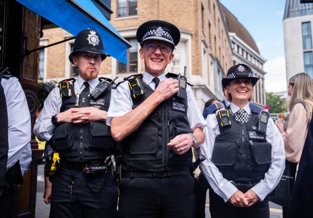 <p>Metropolitan Police Commissioner Sir Mark Rowley (centre) during a walkabout in the West End of London</p>