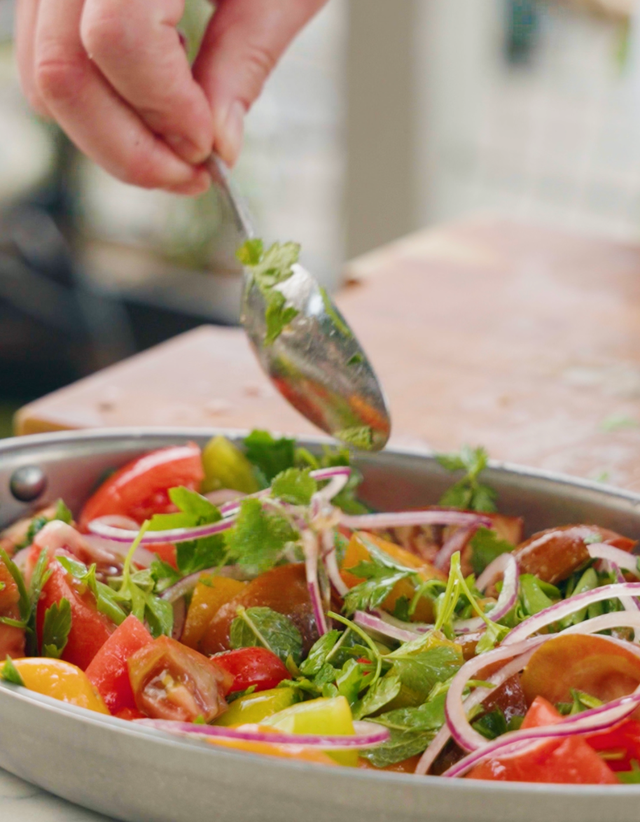 <p>At their peak, heritage tomatoes need almost nothing – just good seasoning, sharp herbs and a glug of olive oil</p>