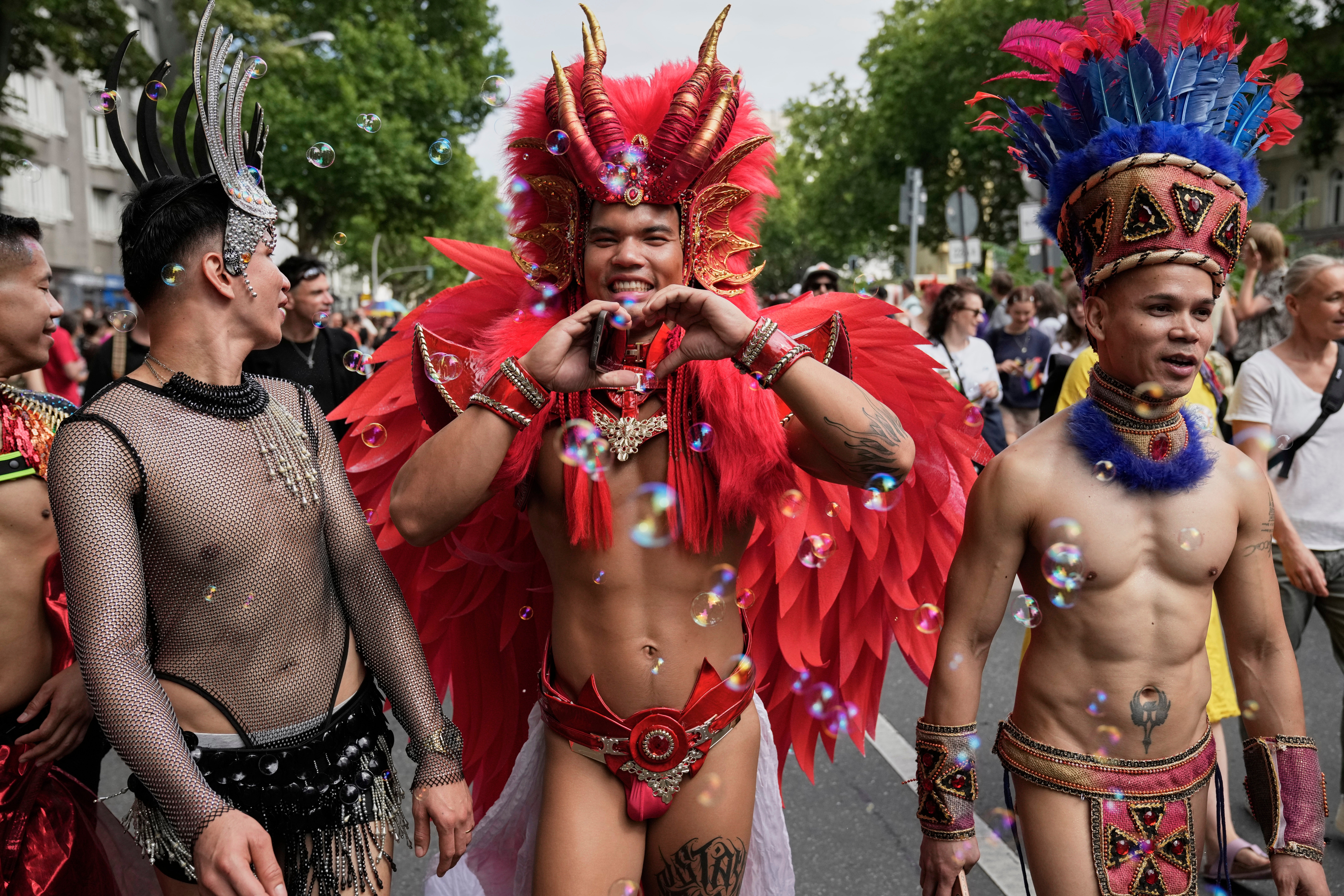 People attend the LGBTQ annual pride march in Berlin, Germany, Saturday, July 26, 2025. (AP Photo/Ebrahim Noroozi)