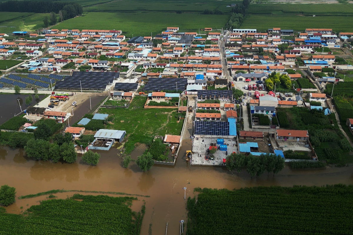 Beijing officials say 31 older people trapped in a senior center died in floods
