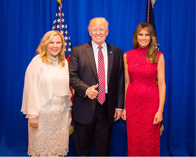 <p>Sherry Xue Li poses with Donald Trump and Melania Trump at a fundraiser dinner in June 2017, a photo Li used to defraud investors that she promised U.S. visas and access to prominent politicians</p>