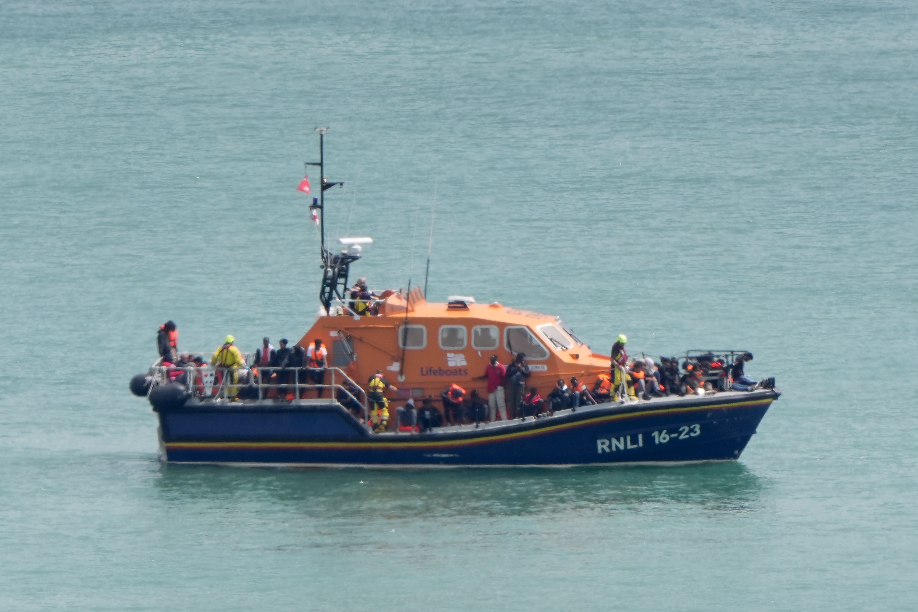 A group of people are taken into the Border Force compound in Dover, Kent, from an RNLI lifeboat following a small boat incident in the Channel