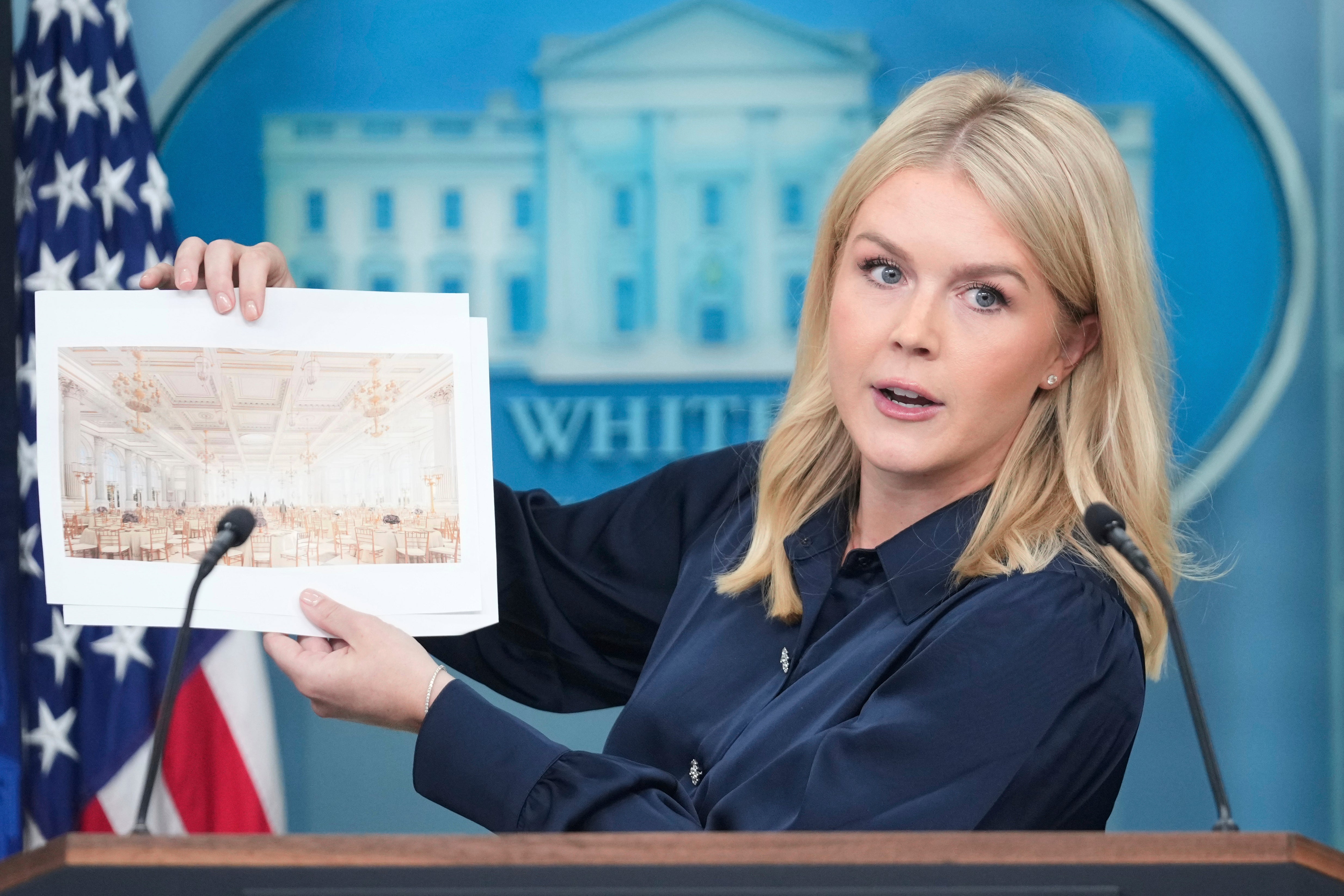 White House press secretary Karoline Leavitt holds up a picture of what the ballroom will look like once completed. The White House has not specified when tours will become available to the public again.