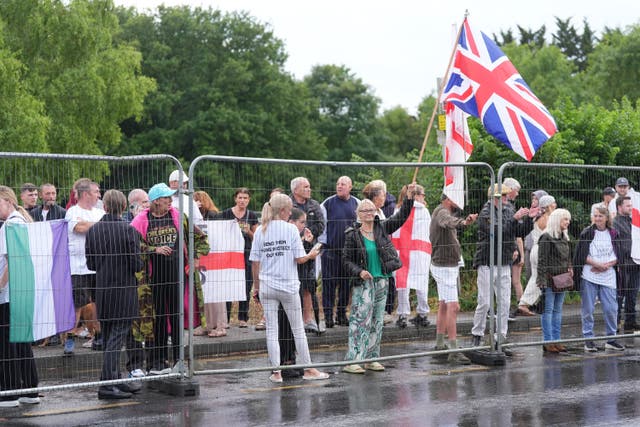 Protesters outside the Bell Hotel in Epping (Yui Mok/PA)
