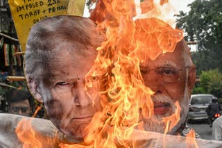 Indiaโs opposition party Congress burn an effigy of US President Donald Trump and Indian Prime Minister Narendra Modi as they protest against the Indo-US trade deal