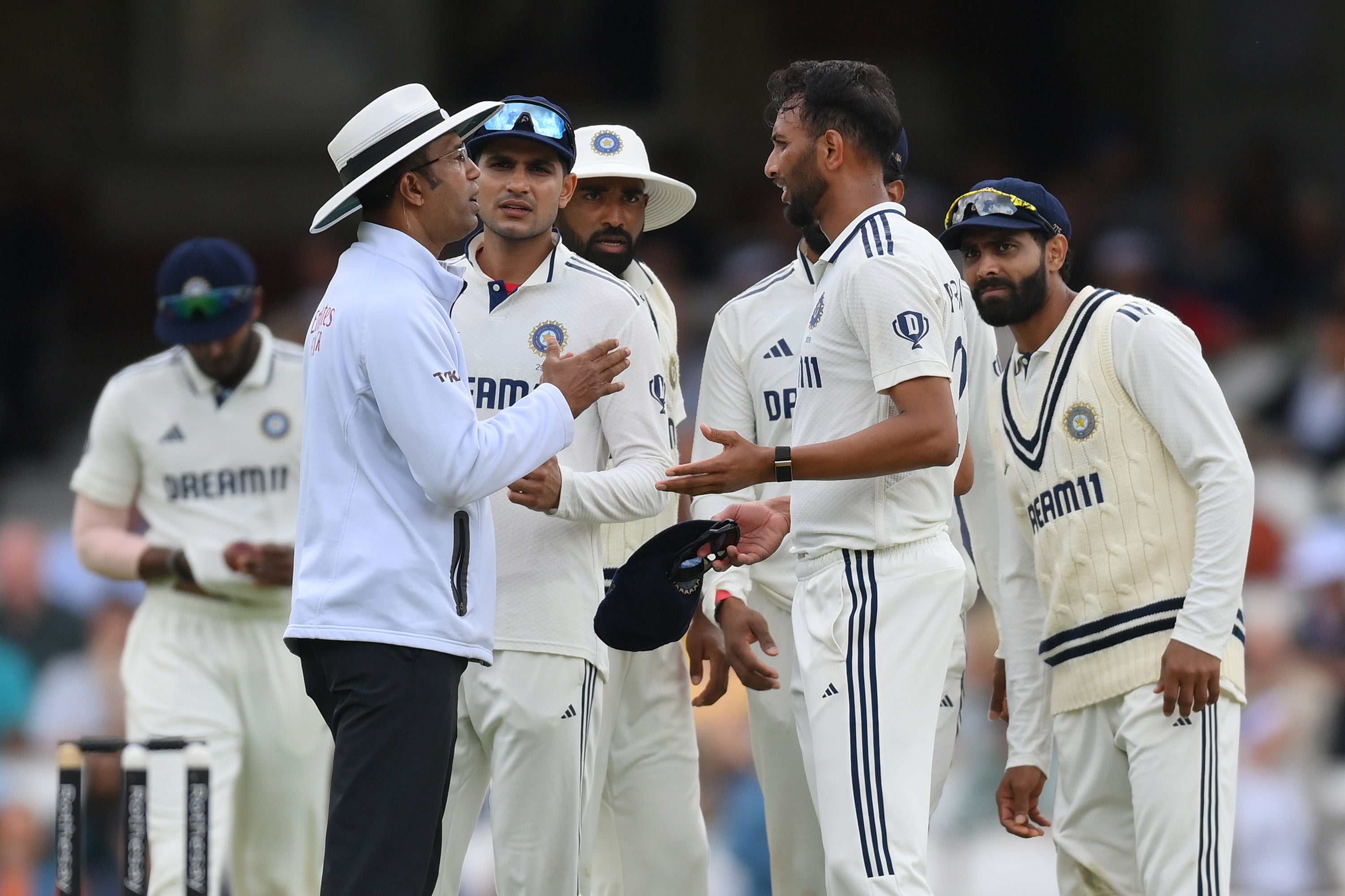 The umpires were forced to intervene amid Root and Krishna’s squabble