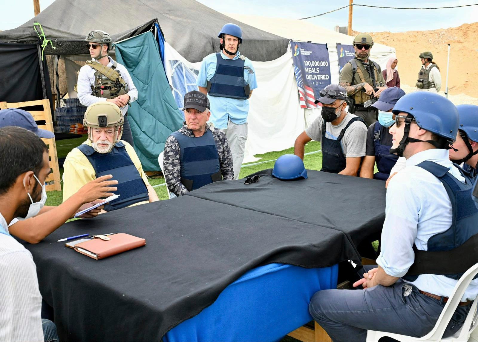 White House special envoy Steve Witkoff, center, and US Ambassador to Israel Mike Huckabee, center left, visit a food distribution site run by the Gaza Humanitarian Foundation, a U.S.-backed organization approved by Israel
