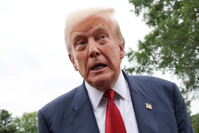 <p>President Donald Trump speaks to reporters ahead of boarding Marine One to depart for a weekend of golf in New Jersey</p>