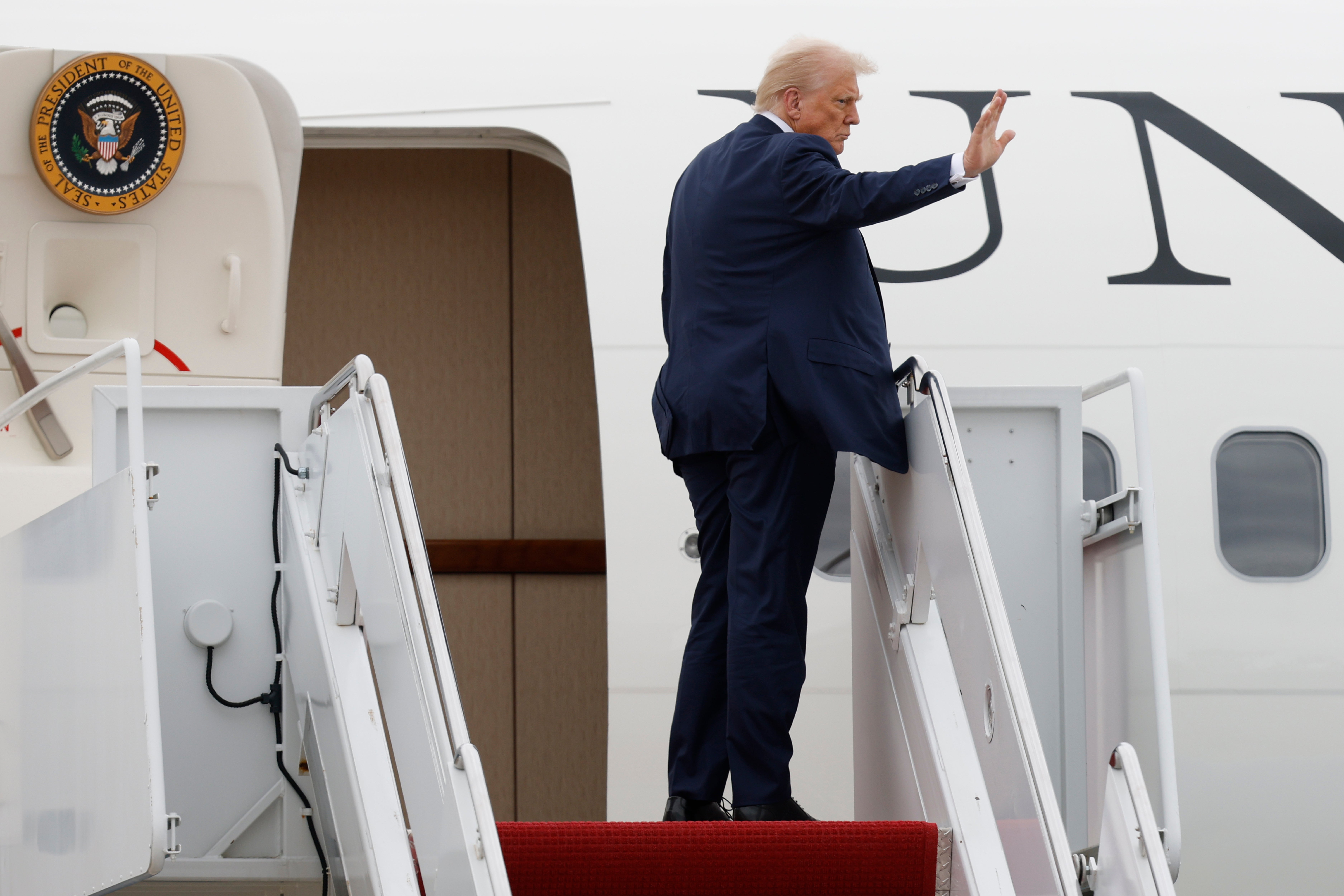File image: Donald Trump waves as he boards Air Force one in Maryland