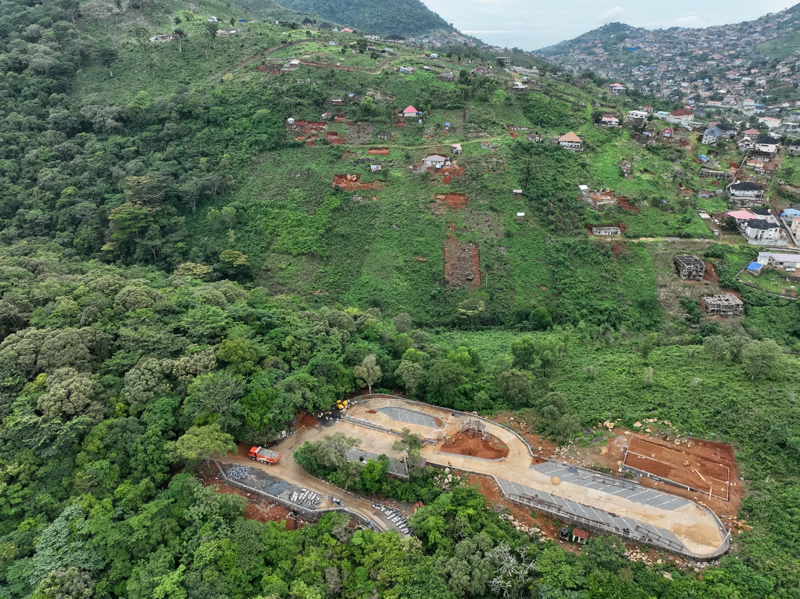 A drone view of illegal constructions and residential buildings encroaching on chimpanzee habitat in the protected forest of Tacugama Sanctuary, in Freetown, Sierra Leone June 9, 2025