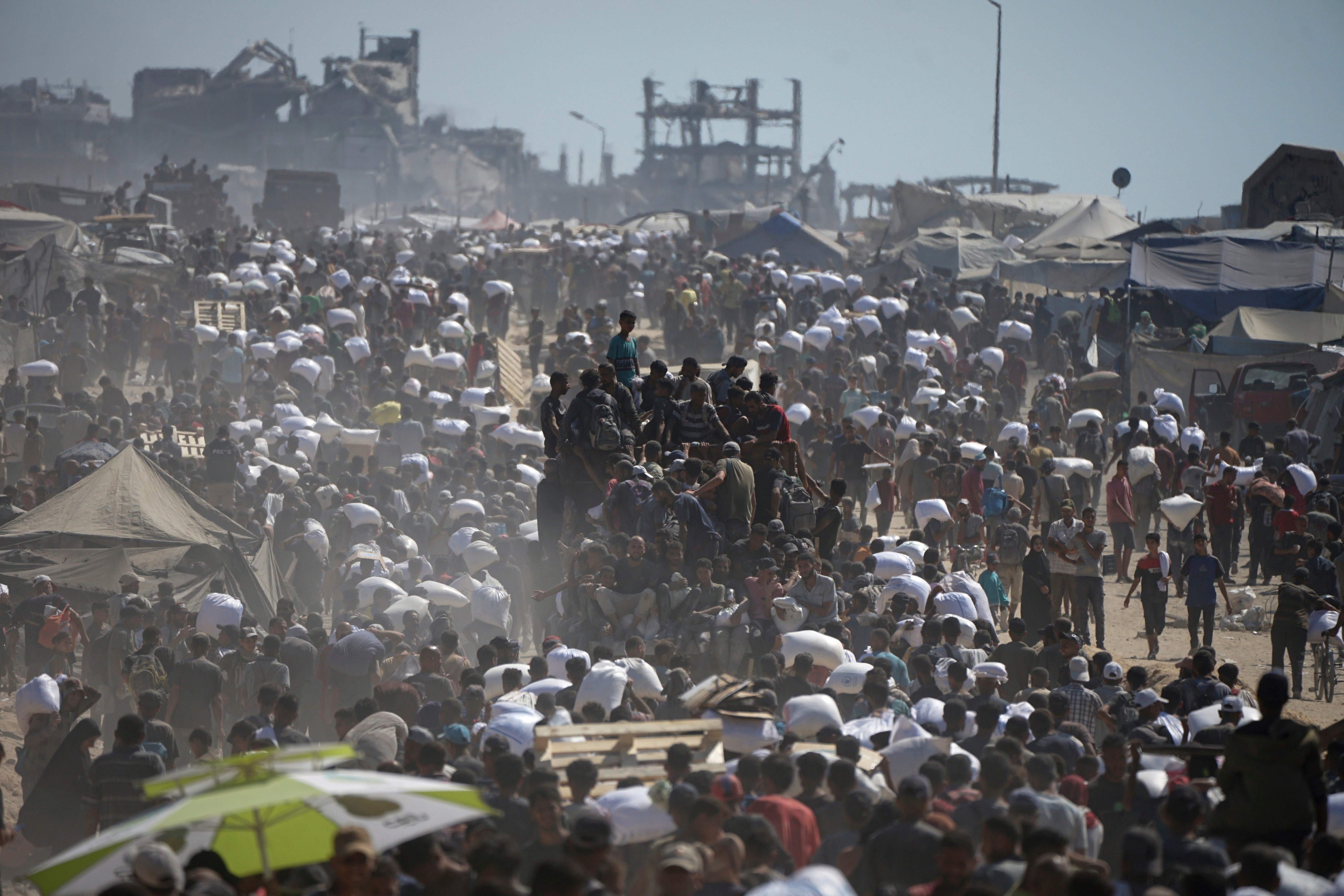 Palestinians clamour for the limited aid in Gaza