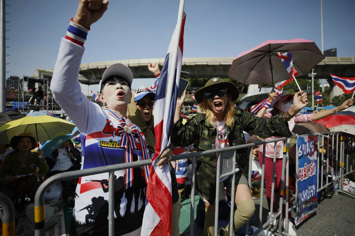 Protesters in Bangkok demand resignation of court-suspended prime minister following deadly conflict