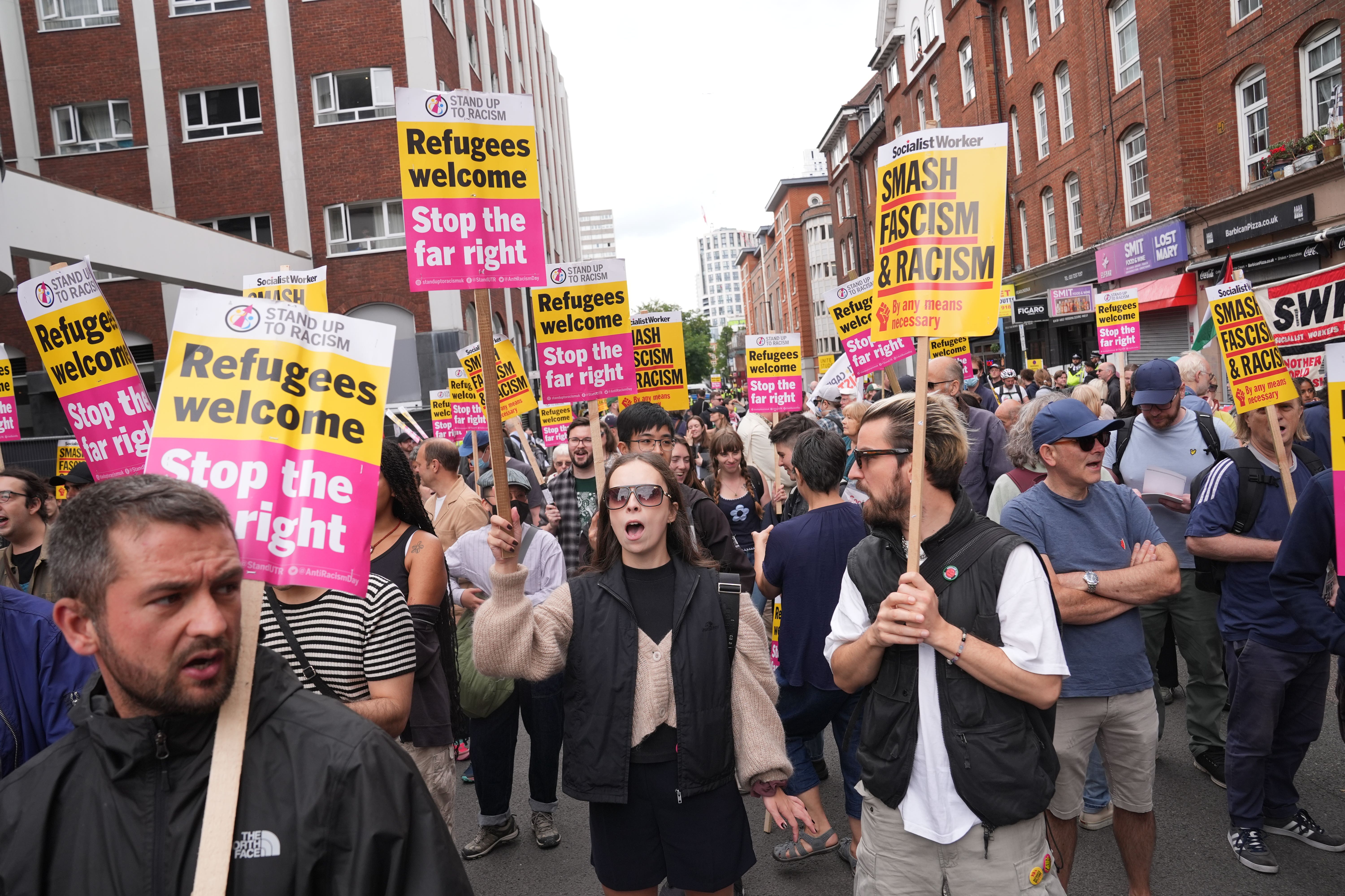 Standing for the protesters of racism, gathered outside the Thiexa Barbikan Hotel in Central London, in which shelter fans (PA) were placed.