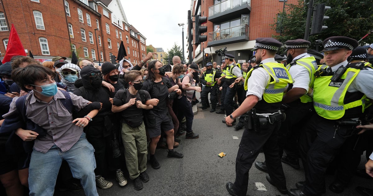 Demonstrators detained by police during rival protests outside ...