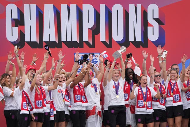 England’s Leah Williamson lifts the trophy as she celebrates with team-mates during a victory parade in London (Gareth Fuller/PA)