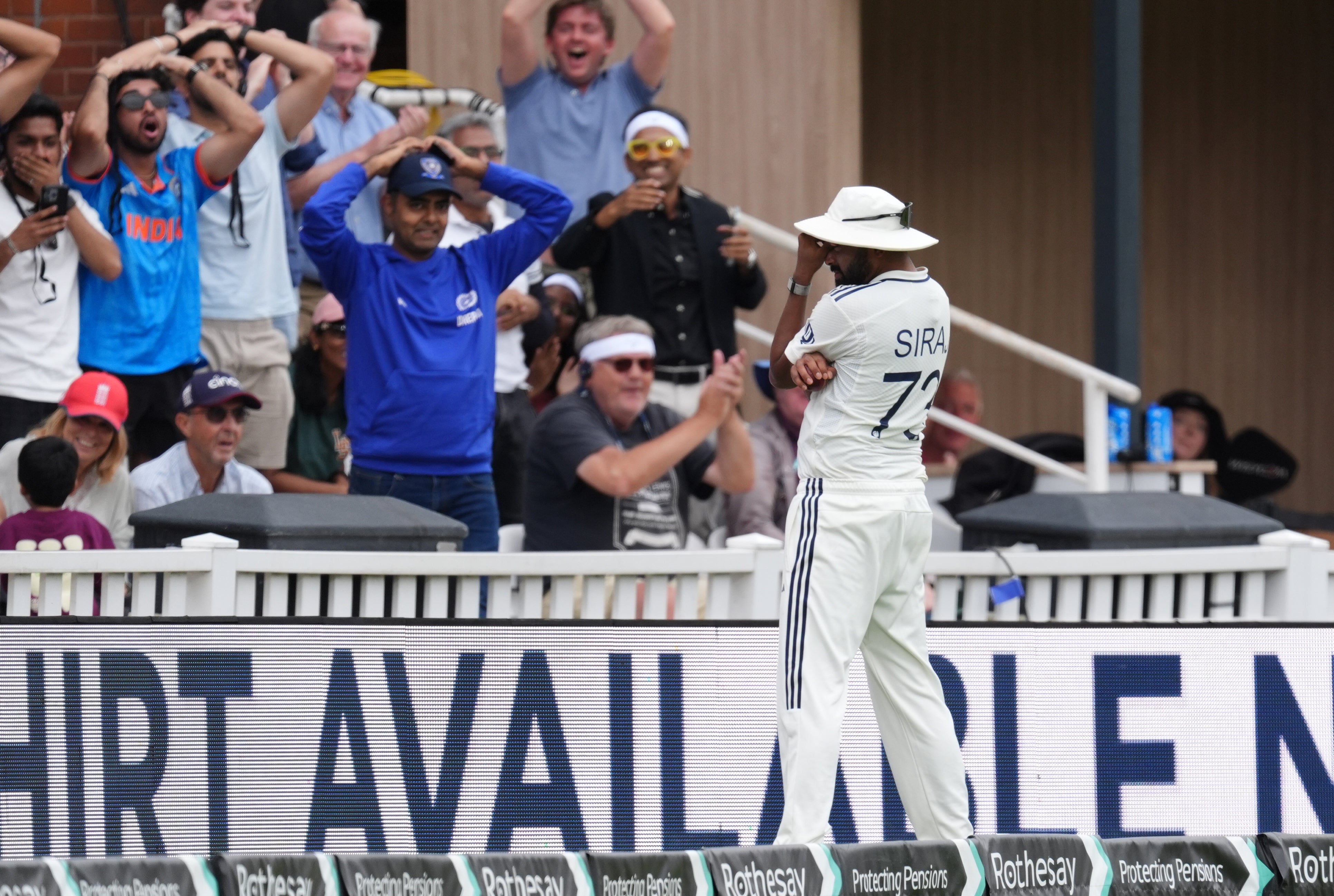 Mohammed Siraj reacts after catching Harry Brook but carrying the ball over the boundary for six (Ben Whitley/PA)