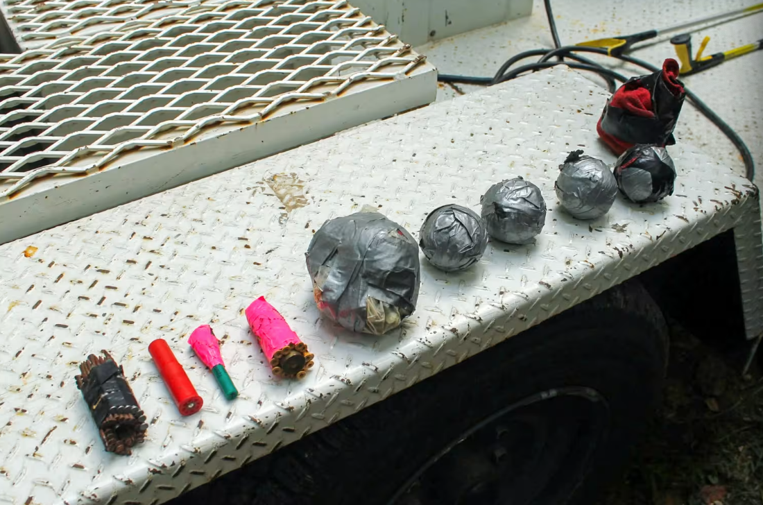 Several of the 14 improvised explosive devices that Polk County, Tennessee deputies allegedly found at the home of Kevin O'Neal on August 1, 2025. O'Neal was arrested and charged with numerous counts, included attempted first-degree murder.