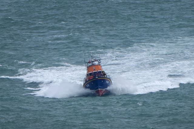 A group of people thought to be migrants are brought in to Dover (Gareth Fuller/PA)