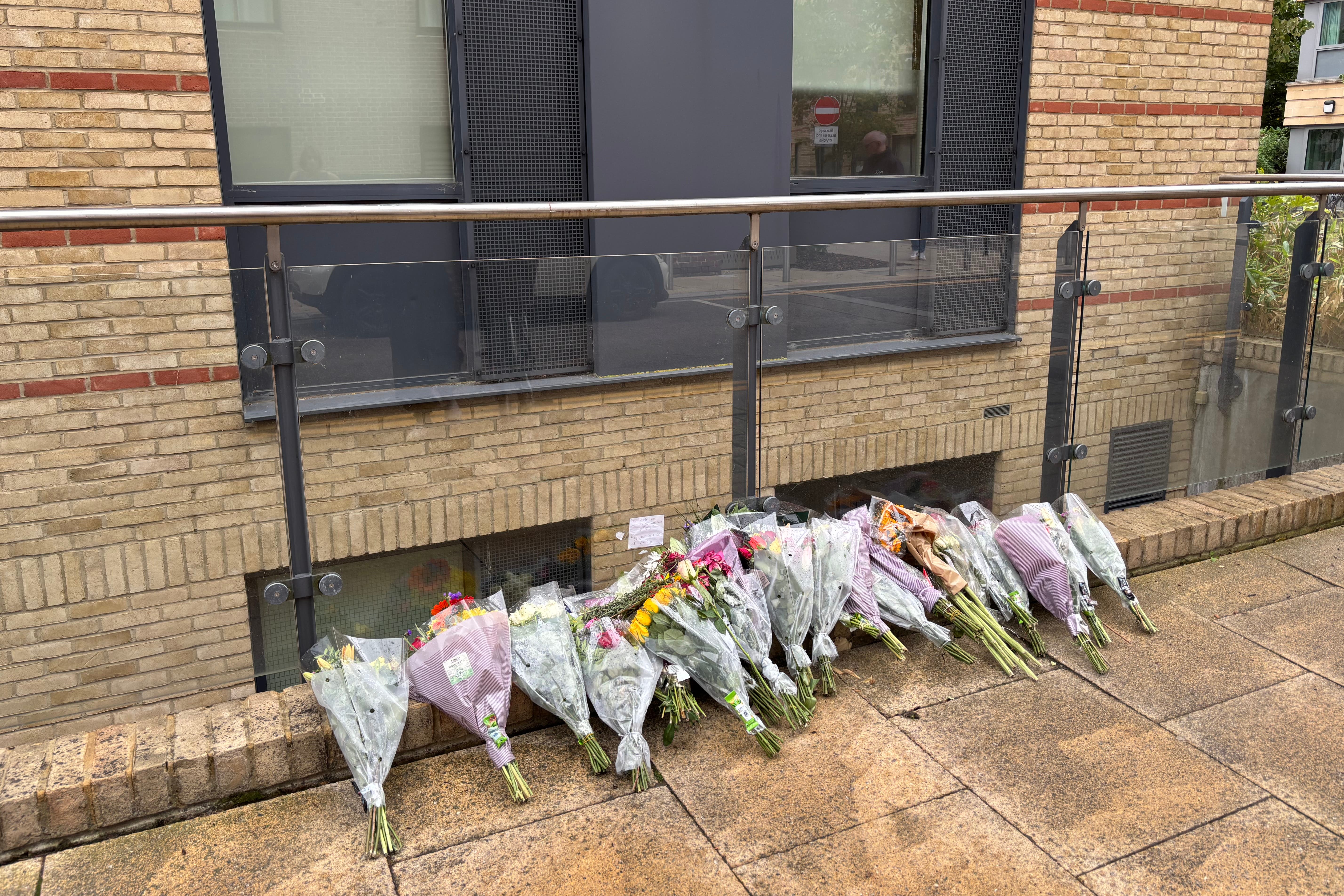 Floral tributes left outside a building in Mill Park in Cambridge after 20-year-old Mohammed Algasim, from Saudi Arabia, was fatally attacked (Sam Russell/ PA)