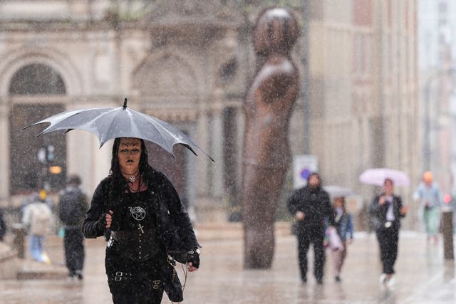 Umbrellas were out in force in Birmingham (Jacob King/PA)