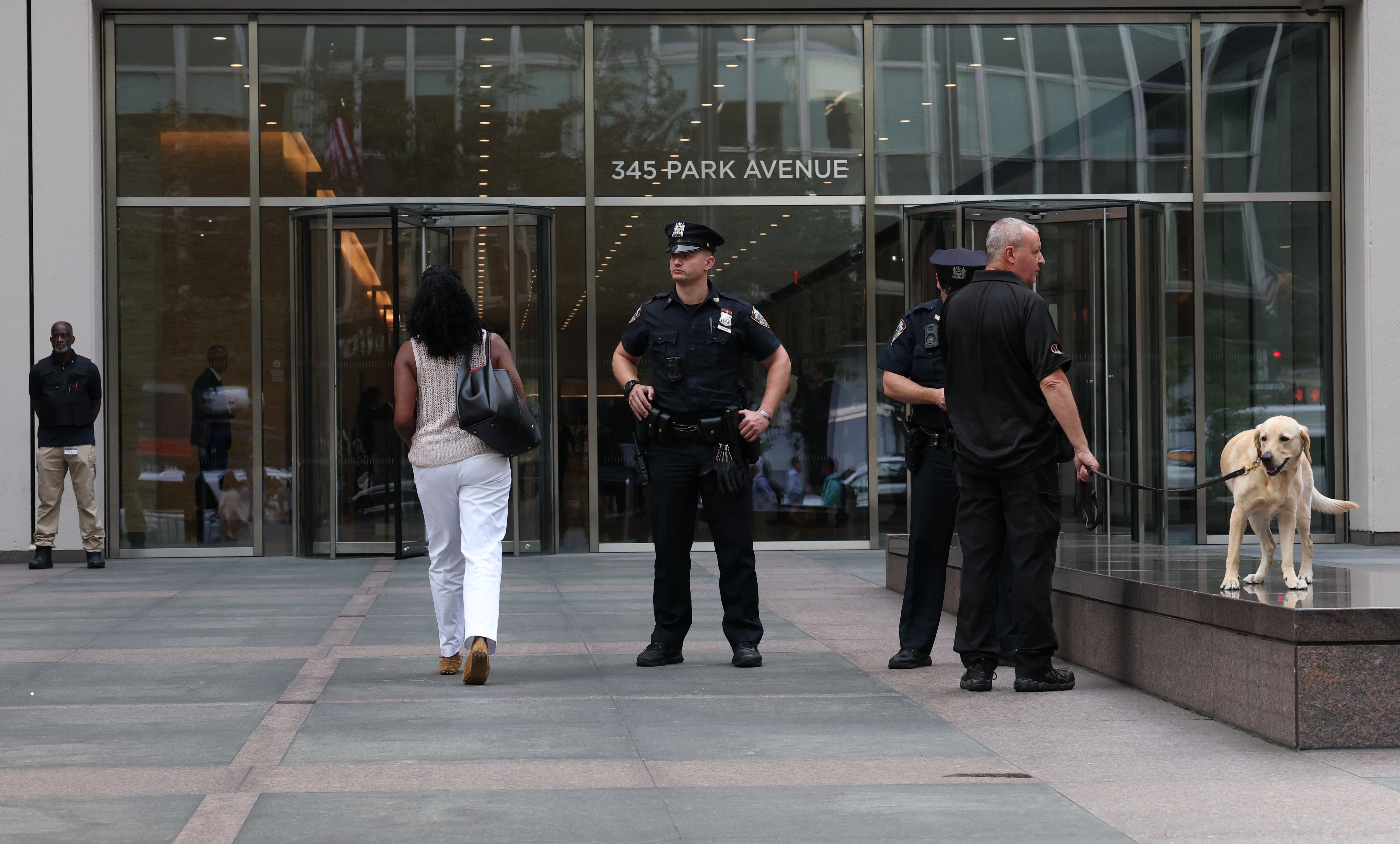 Workers returned on Monday to 345 Park Avenue in Manhattan, the New York City office tower where a gunman killed four people then himself a week ago