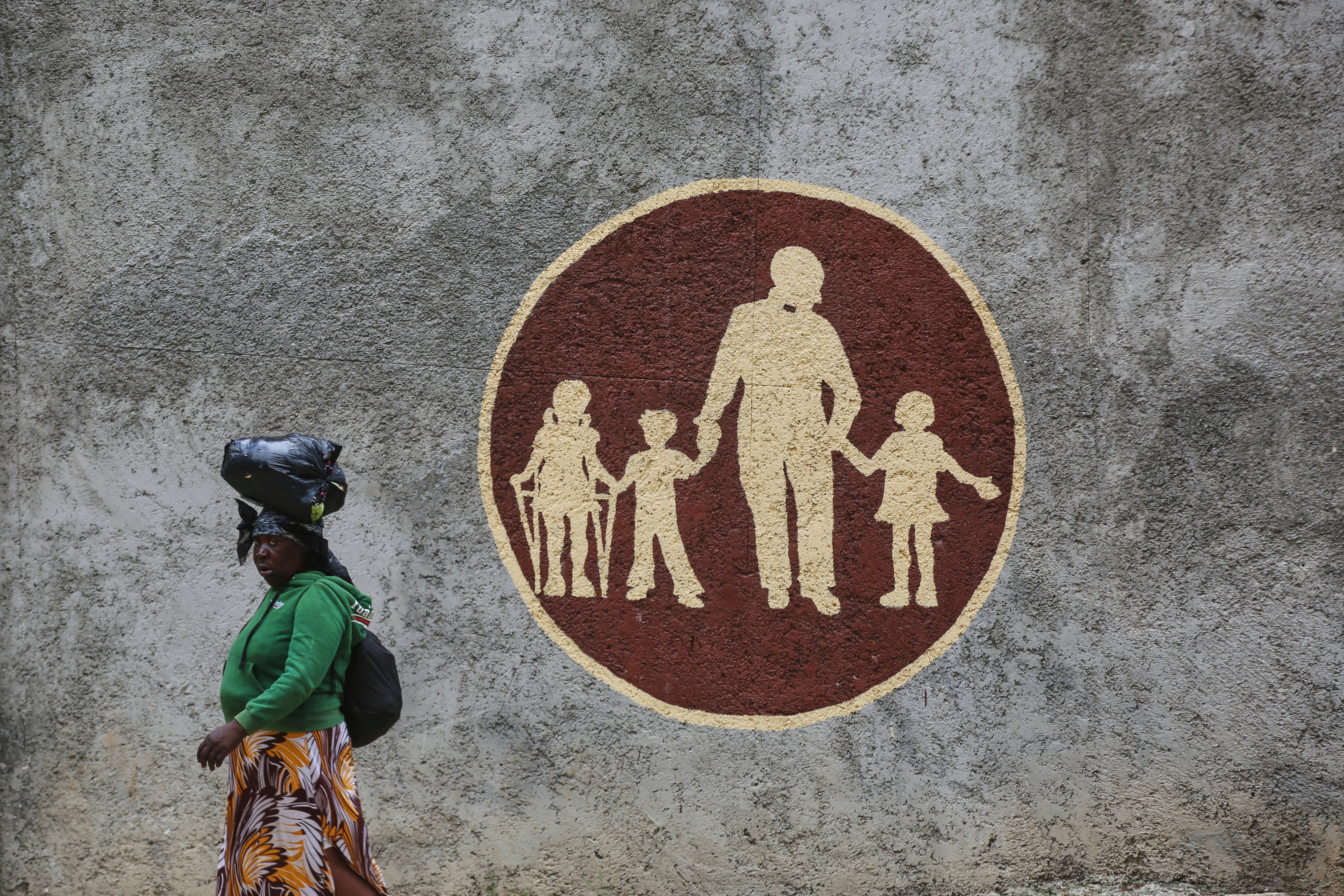 A woman walks past the orphanage