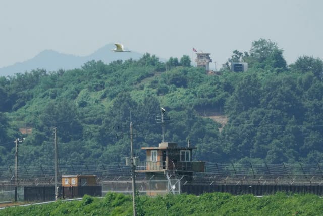 <p>A North Korean military guard post, loudspeaker, top right, and South Korean military guard post, bottom, are seen from Paju, South Korea, near the border with North Korea,</p>