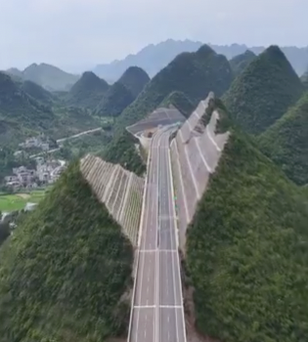 Engineers carve mountain in two to make way for world’s tallest bridge