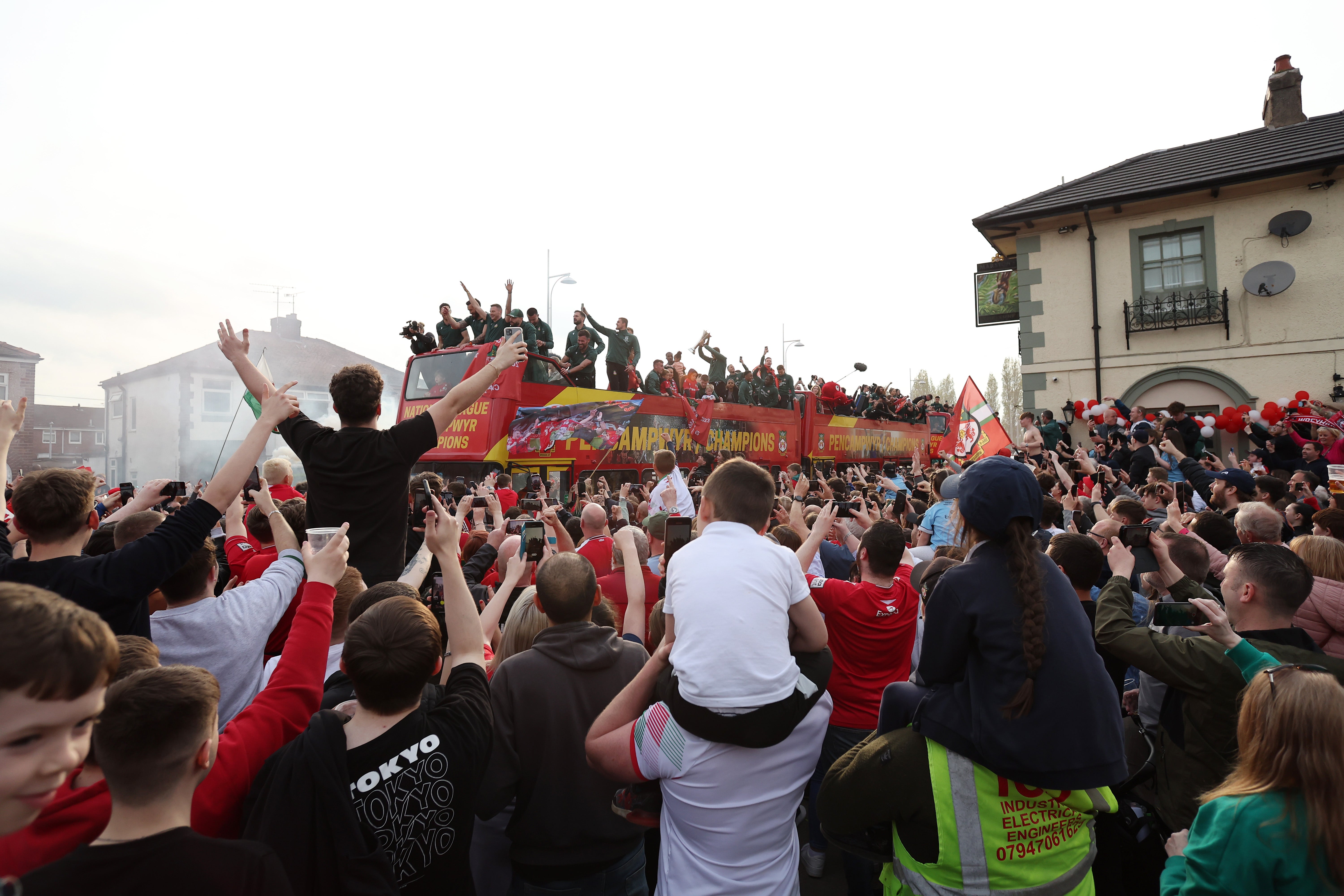 Wrexham celebrate their National League-winning campaign in May 2023
