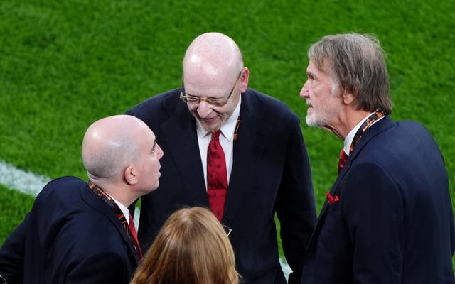 <p>Avram Glazer and Sir Jim Ratcliffe speak to Manchester United chief executive Omar Berrada at the Europa League final (Andrew Milligan/PA)</p>