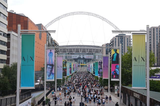 Oasis fans on Wembley Way (Lucy North/PA)