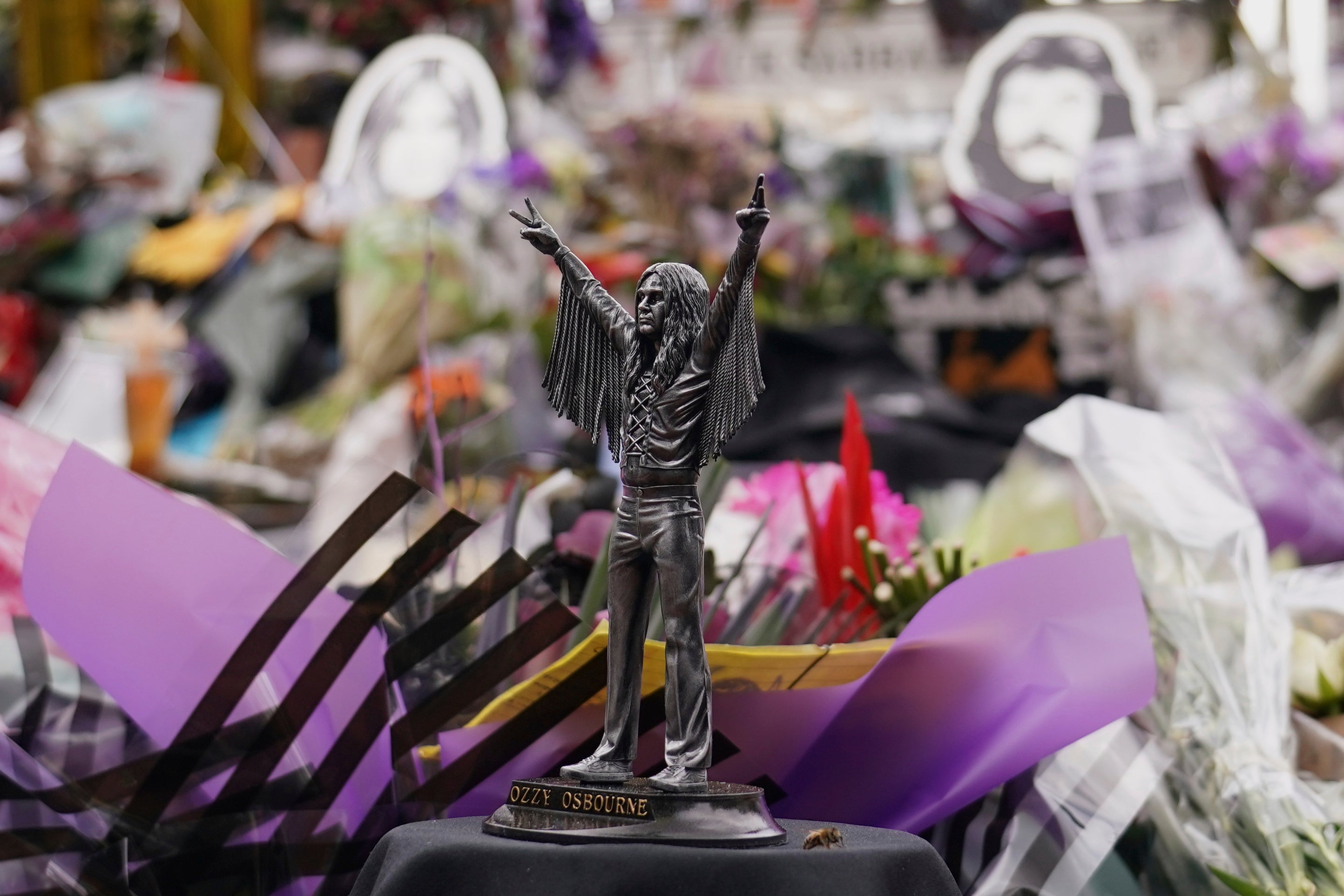 <p>Tributes left in front of the 'Black Sabath bridge' to honour Ozzy Osbourne</p>