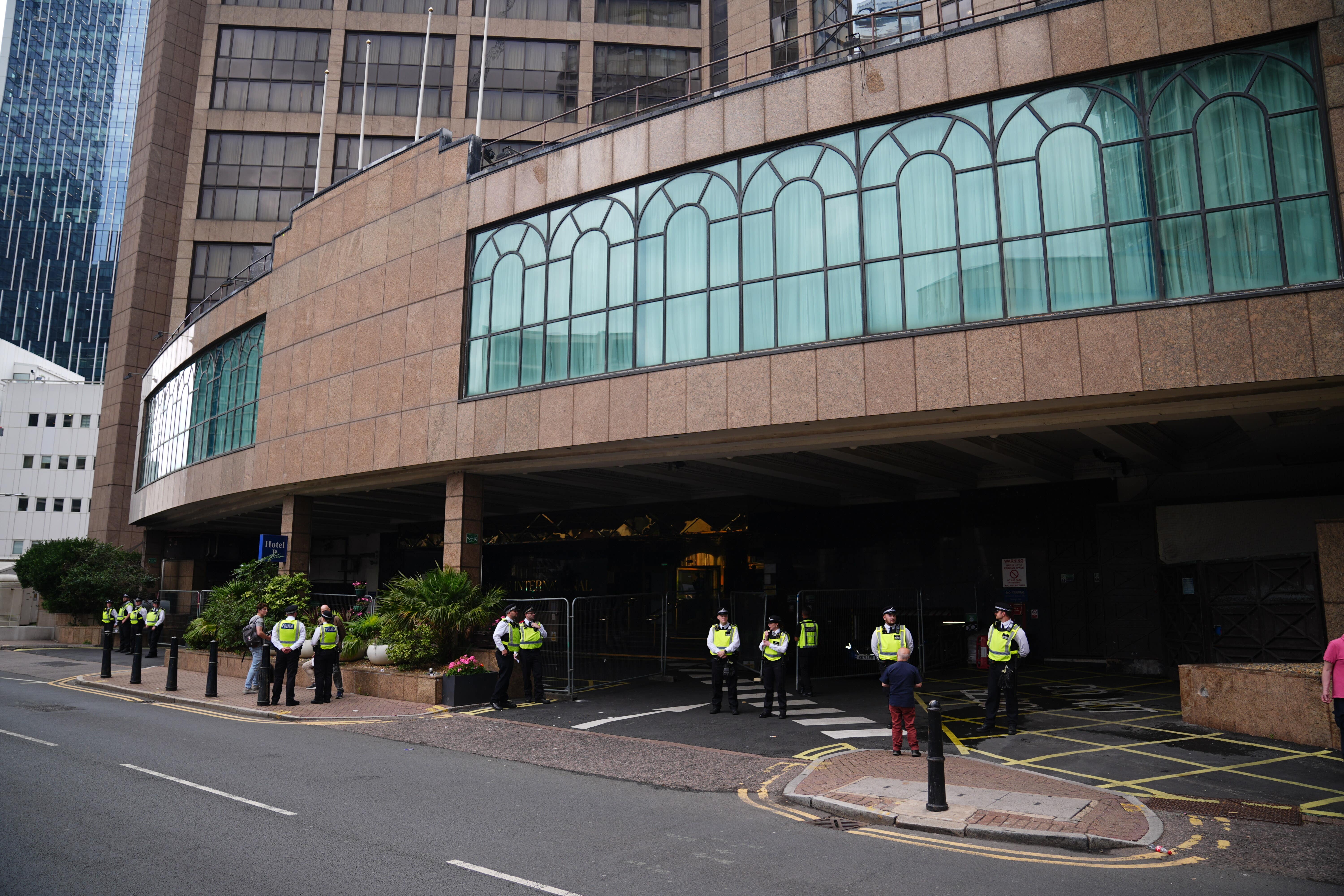 Police officers outside The Britannia International Hotel in Canary Wharf, London (James Manning/PA)