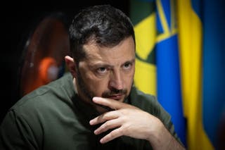 Ukraine's president Volodymyr Zelensky looks on as he meets with soldiers on the frontline positions at an undisclosed location in the Kharkiv region