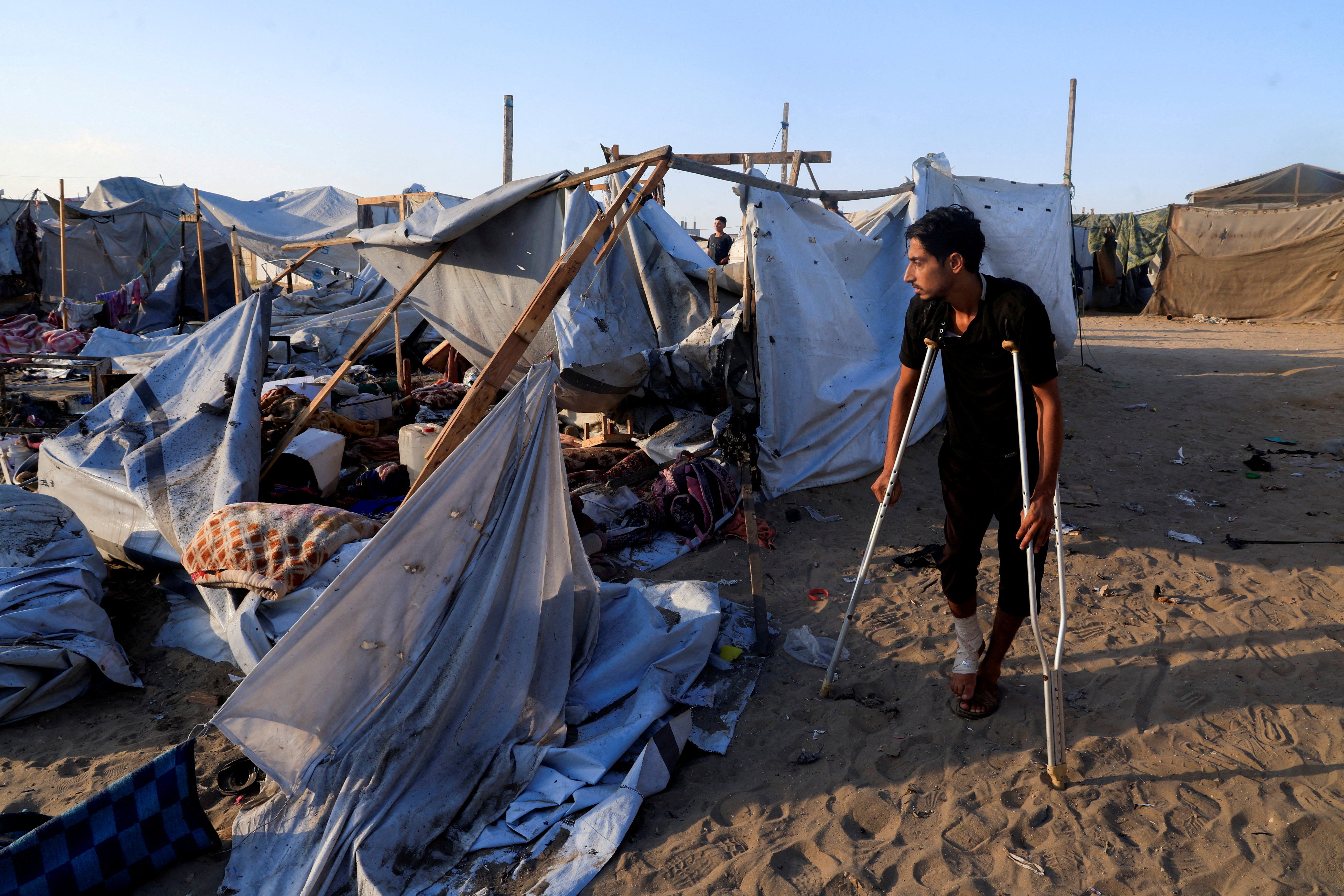 The aftermath of an overnight Israeli strike on a tent sheltering displaced people in Khan Younis, southern Gaza Strip