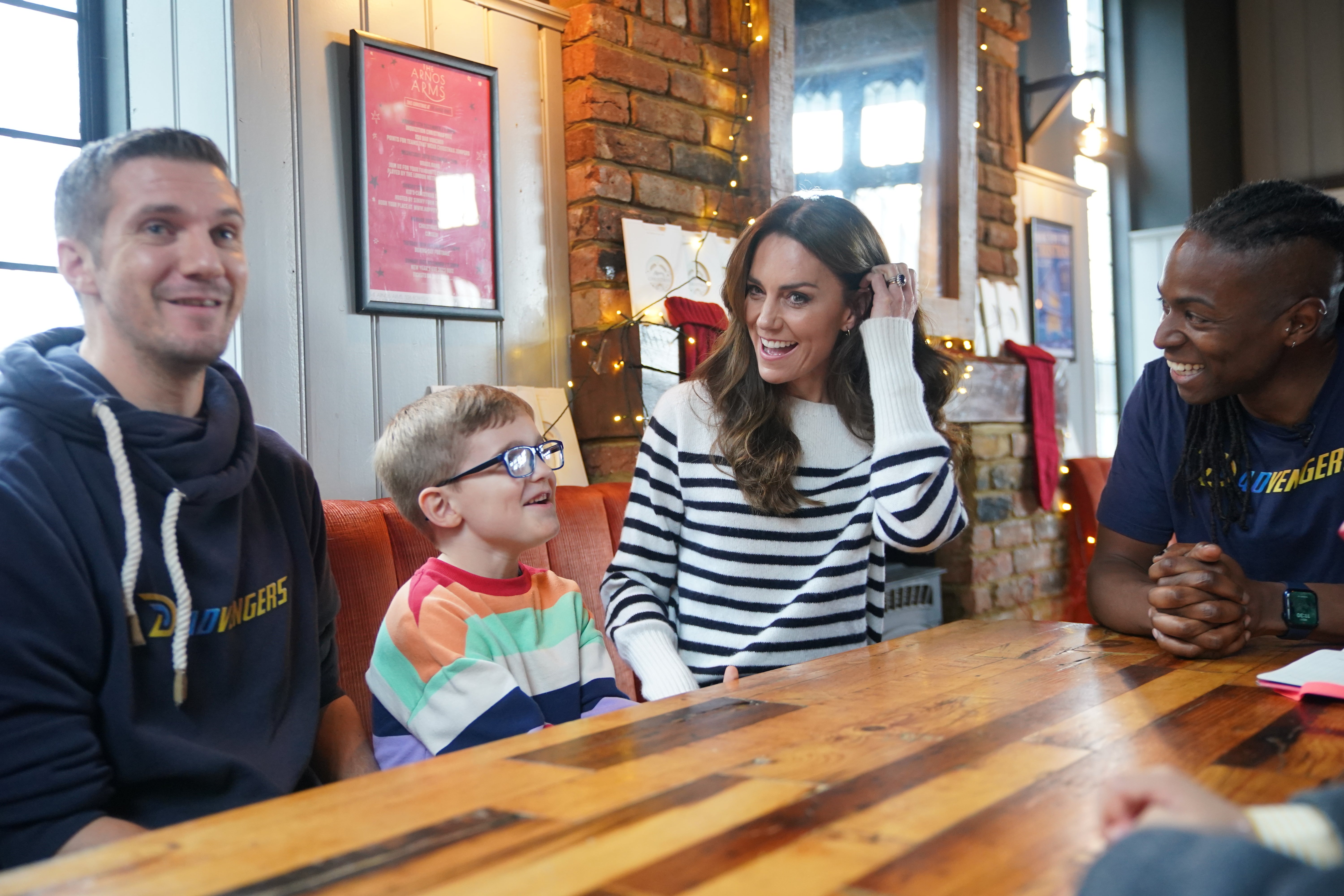 <p>Kate meeting fathers and their sons during a visit to Dadvengers, a community for dads and their children, in Arnos Grove, north London</p>