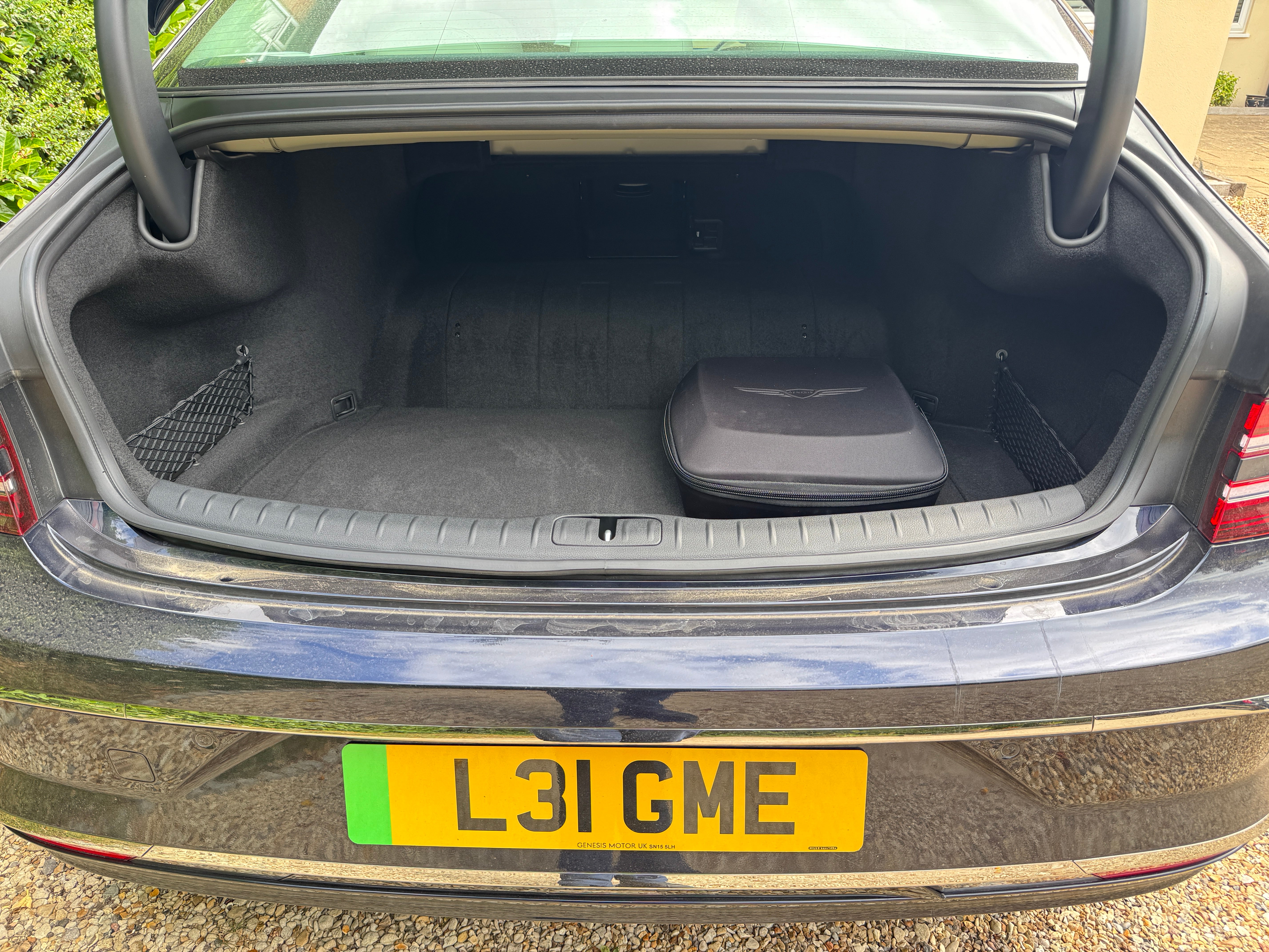 The Genesis G80 boot isn't huge, but it's luxuriously trimmed. You even get a charging cable in a lovely case!