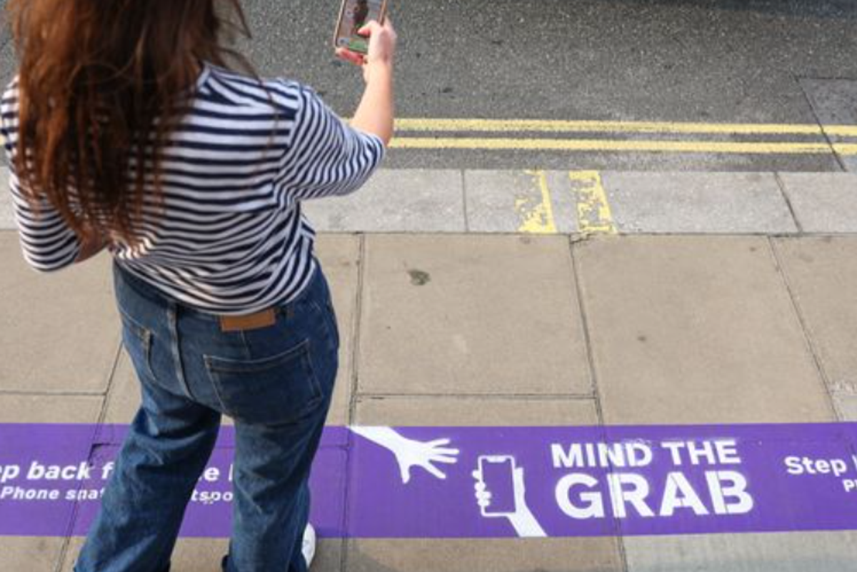 ‘Mind the grab’: Oxford Street shop paints phone theft warnings onto street