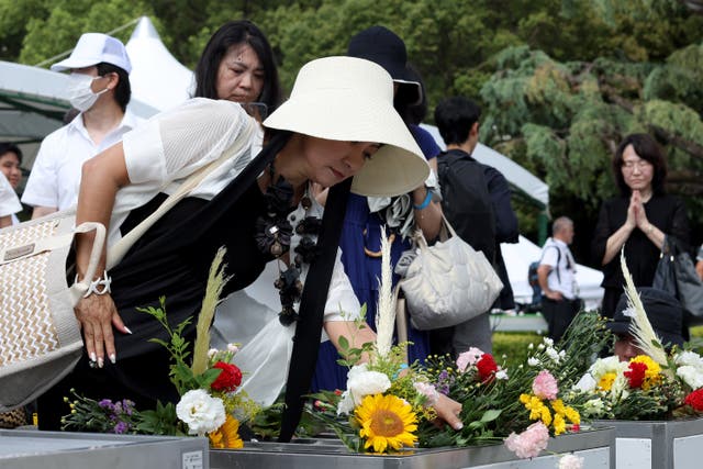 <p>People lay flowers at the Hiroshima Peace Memorial after the 80th anniversary ceremony of the atomic bombing of Hiroshima, on August 06, 2025 in Hiroshima, Japan</p>