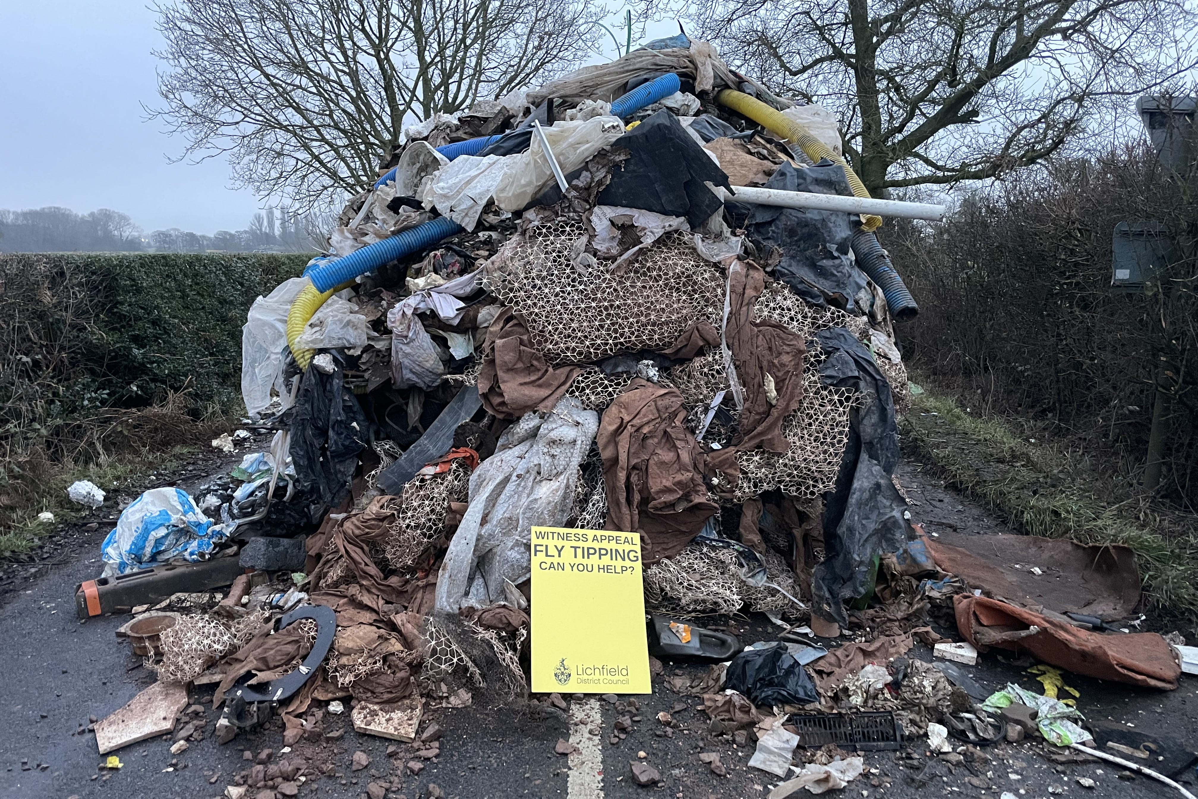 <p>A 27-tonne mound of waste was dumped in Watery Lane, on the outskirts of Lichfield in Staffordshire on January 19 (Phil Barnett/PA)</p>