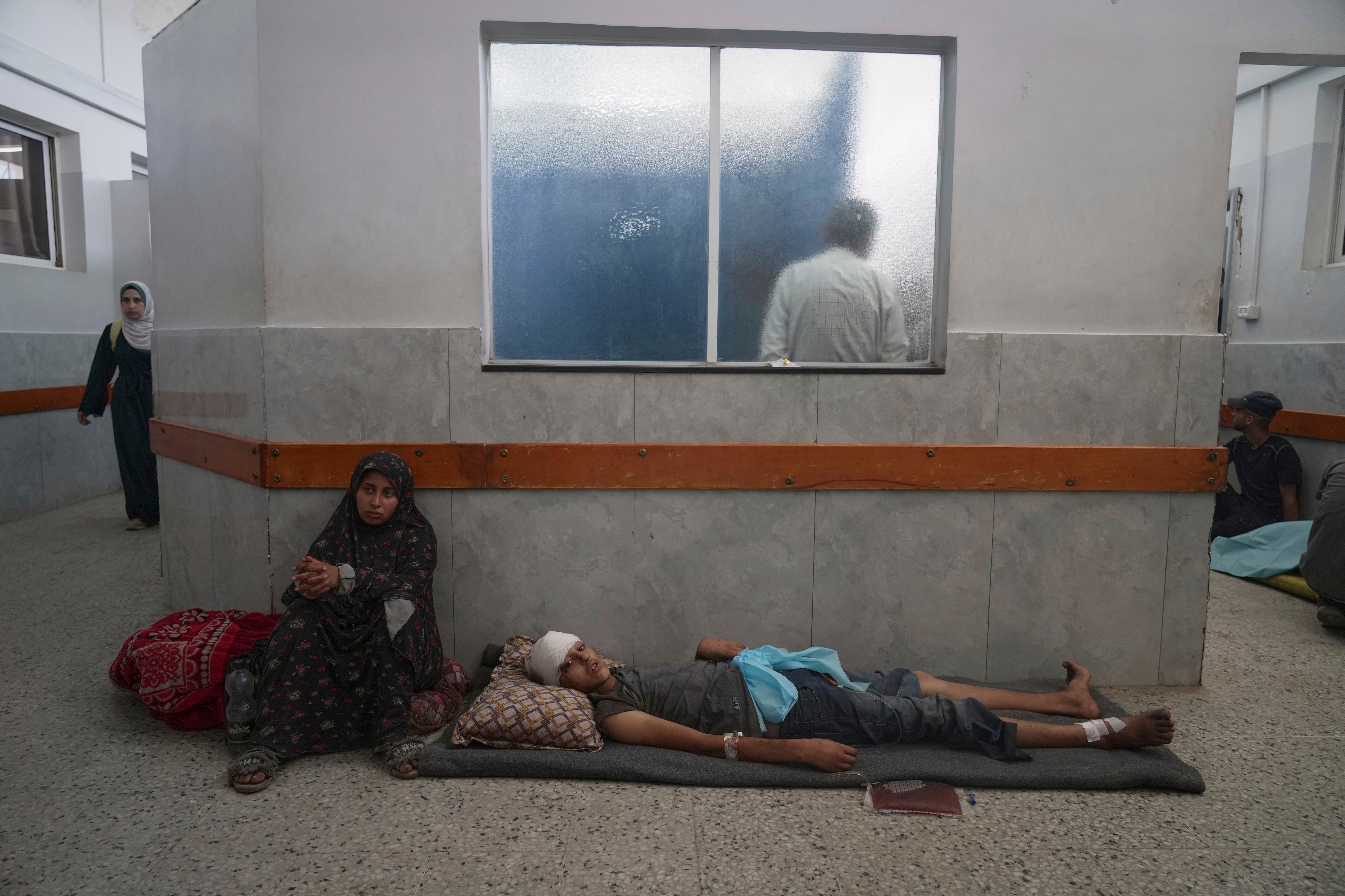 An injured boy waiting for treatment at Shifa Hospital in Gaza City