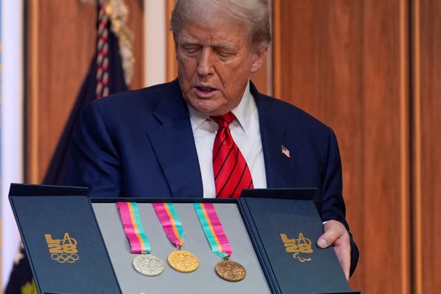 <p>President Donald Trump accepted a set of medals from the 1984 Summer Olympics on Tuesday</p>